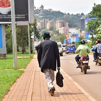 Elderly-man-walking-in-Kampala