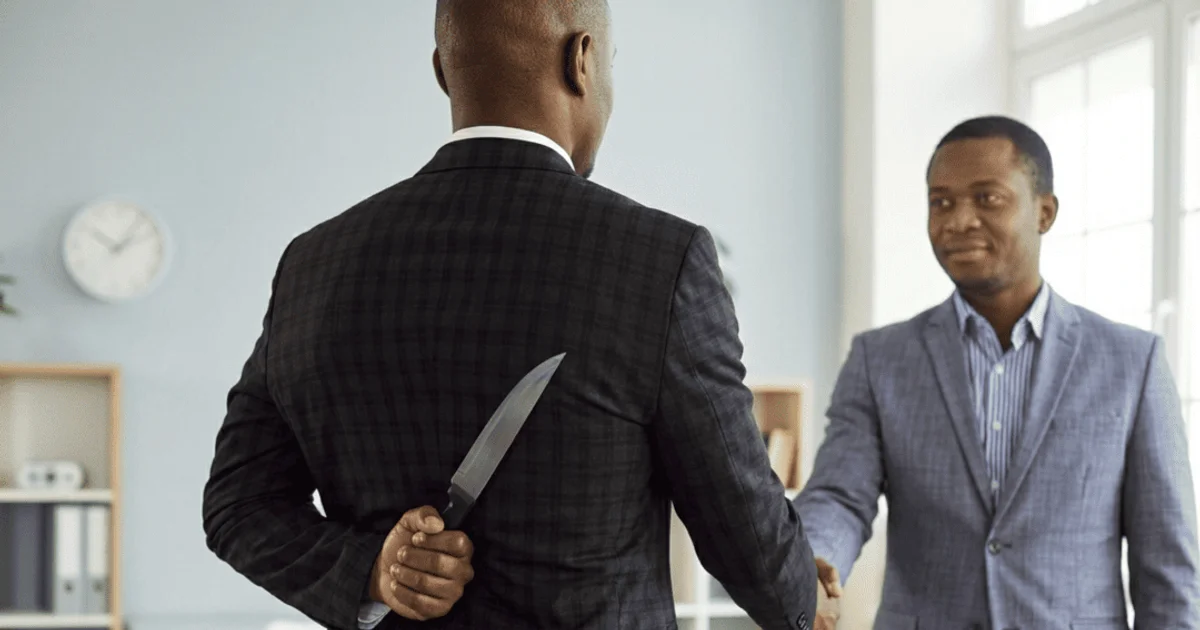 Backstabbing friend with knife in one hand hidden