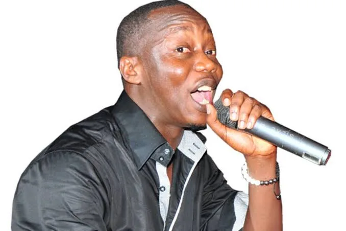 mesach-Semakula-with-mic-in-hand