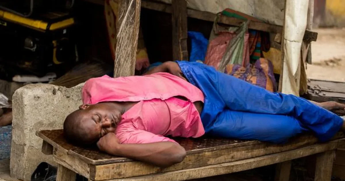 young-man-sleeping-on-bench